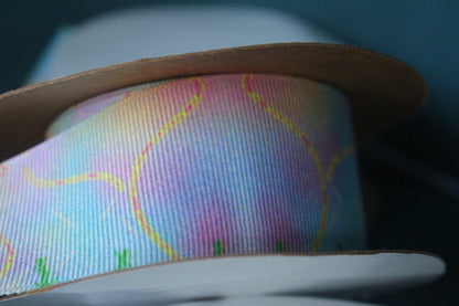 Desert-themed grosgrain ribbon for gifts and crafts. Abstract with yellow lines, pink dashes and black dots. 