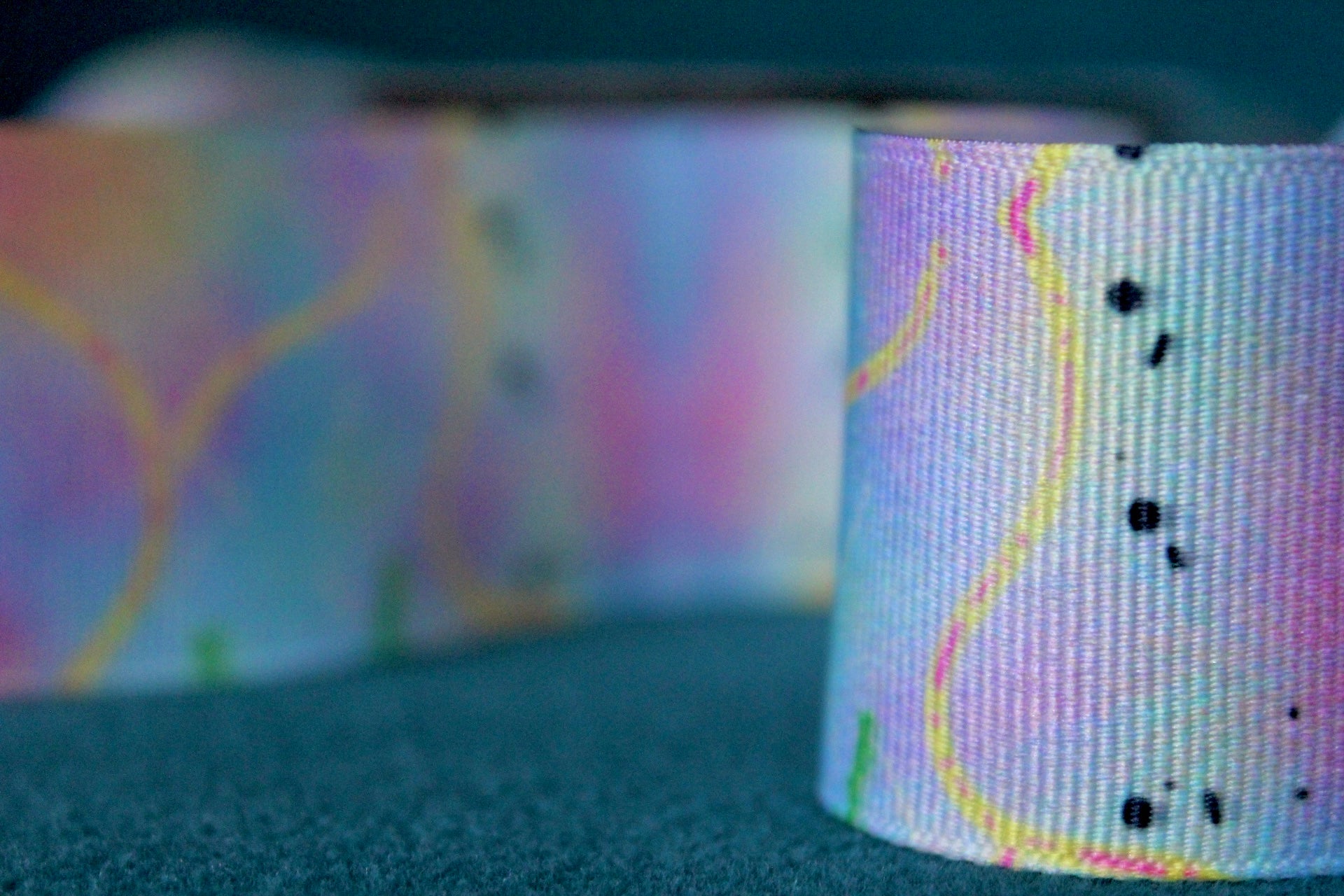 Desert-themed grosgrain ribbon for gifts and crafts. Abstract with yellow lines, pink dashes and black dots. 