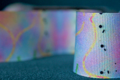 Desert-themed grosgrain ribbon for gifts and crafts. Abstract with yellow lines, pink dashes and black dots. 