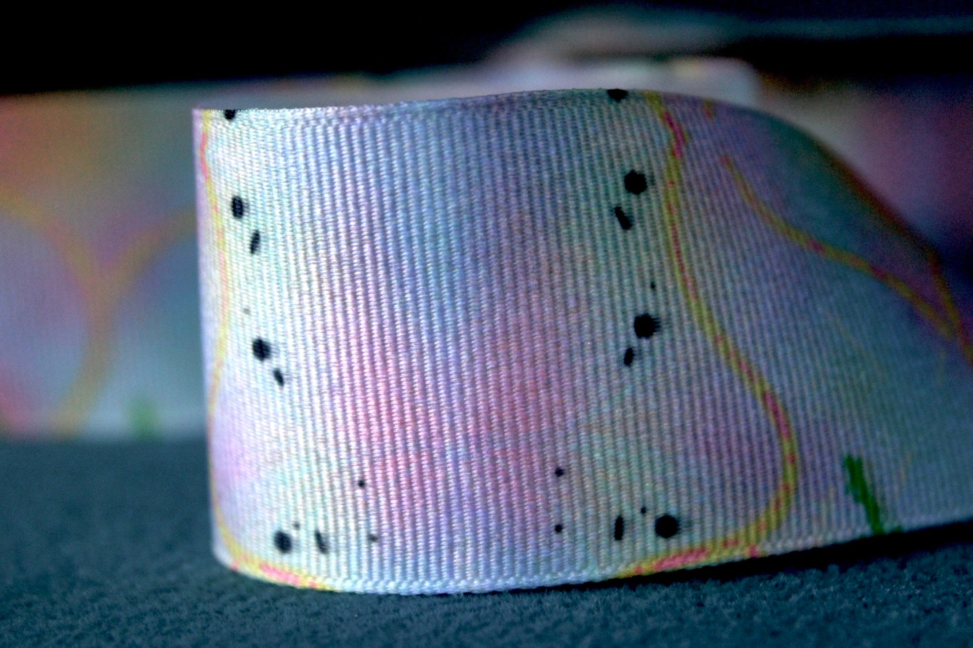Desert-themed grosgrain ribbon for gifts and crafts. Abstract with yellow lines, pink dashes and black dots. 