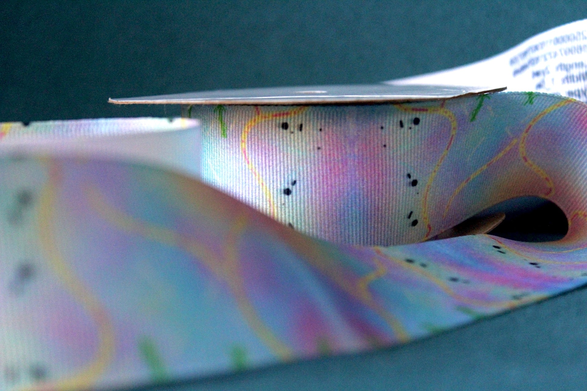 Desert-themed grosgrain ribbon for gifts and crafts. Abstract with yellow lines, pink dashes and black dots. 